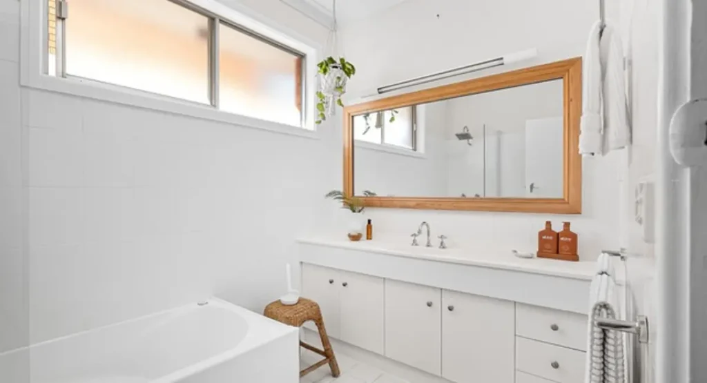 Industrial-style bathroom with exposed brick walls, steel fixtures, and concrete finishes for a bold, modern look.