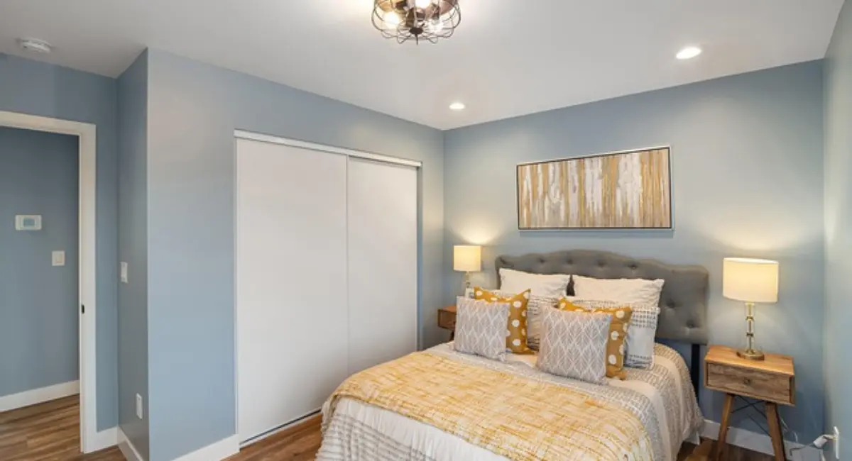 Luxury kids bedroom with bespoke furniture, soft pastel tones, ambient lighting, and a cozy reading nook, creating a magical and practical space for children.