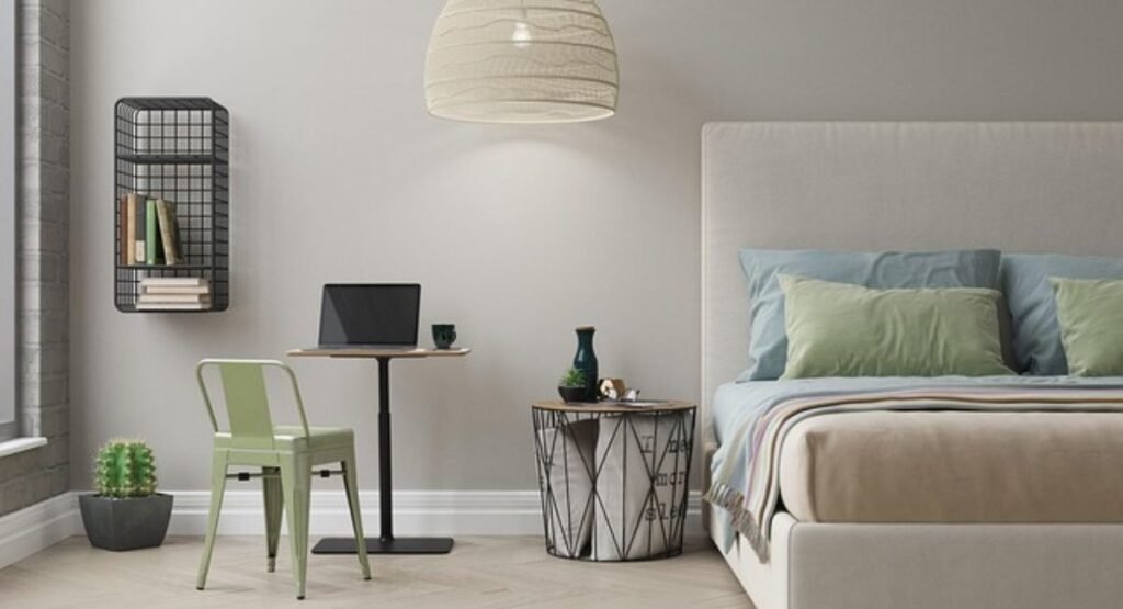 Coastal bedroom with soft blue ceiling, under-bed baskets for hidden storage, and black accents for a modern not tacky feel