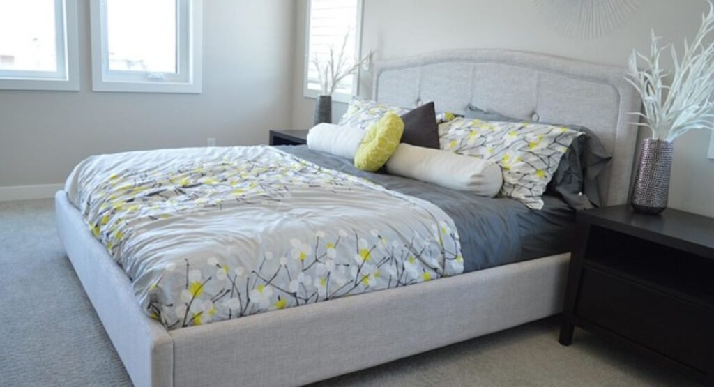 romantic bedroom with upholstered headboard