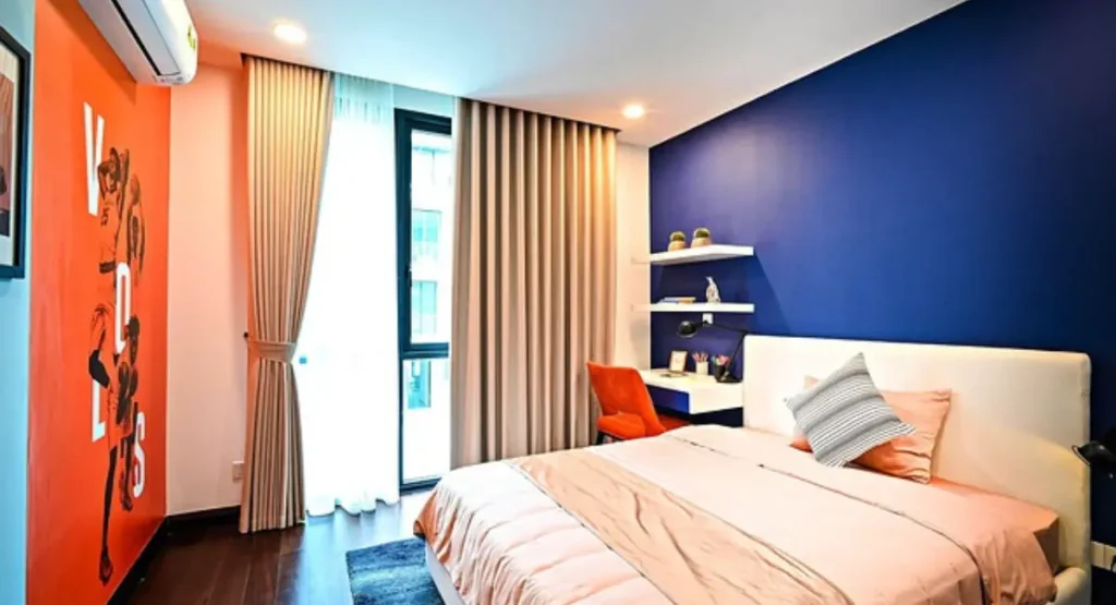 Bespoke kids furniture including a convertible crib and adjustable desk, designed for growth and longevity in a luxury kids bedroom.