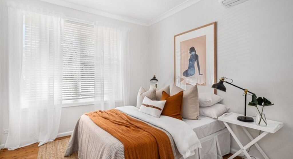 romantic bedroom with layered bedding and soft pillows