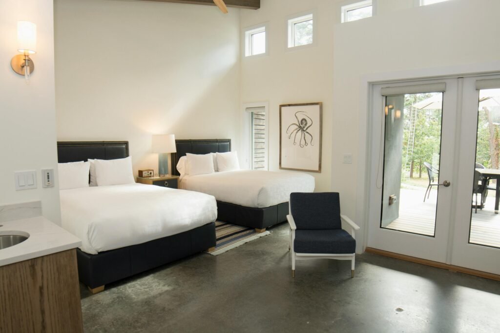 cozy shared bedroom with built-in nightstands, matching throws, and decorative pillows