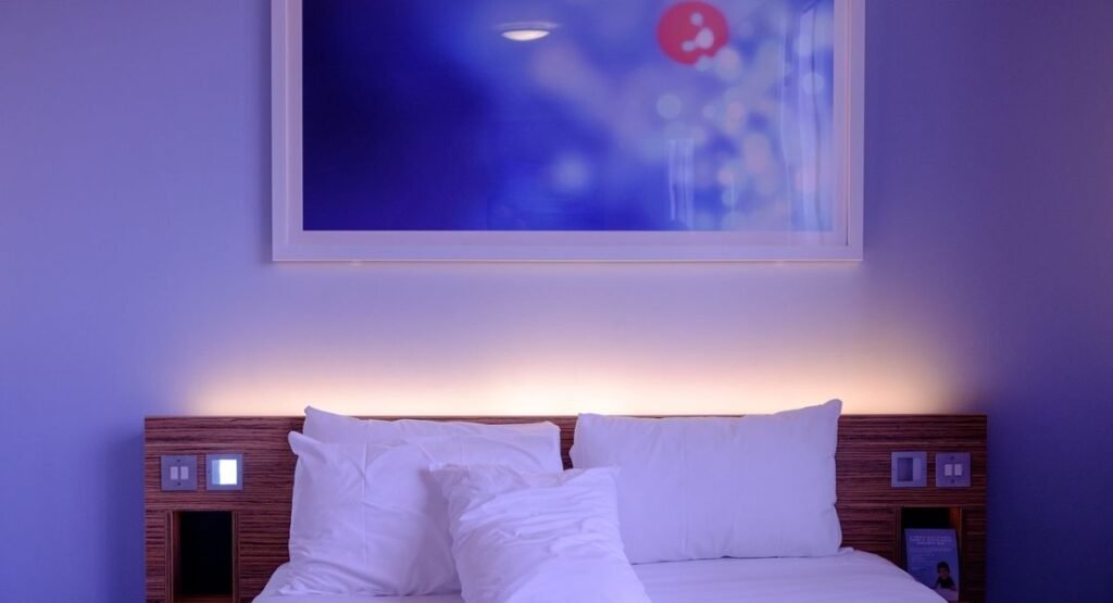 elegant twin bedroom with wooden accents, bench at bed foot, and floor-to-ceiling curtains