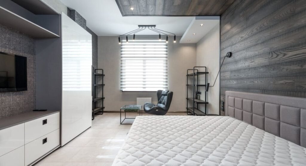 Modern futon bedroom with low wooden platform bed and hidden storage drawers