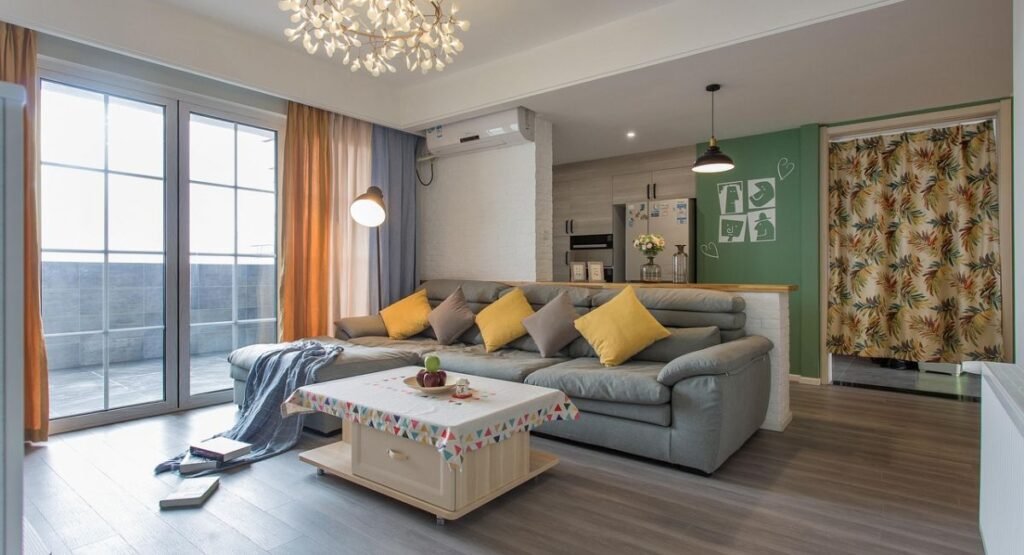 Small studio futon bedroom with foldable bed, floor cushions, and multifunctional layout